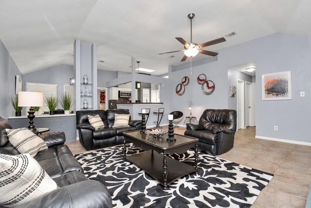 living room with ceiling fan and lofted ceiling