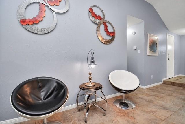 bathroom featuring vaulted ceiling