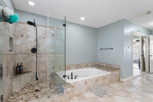 bathroom featuring ceiling fan and separate shower and tub