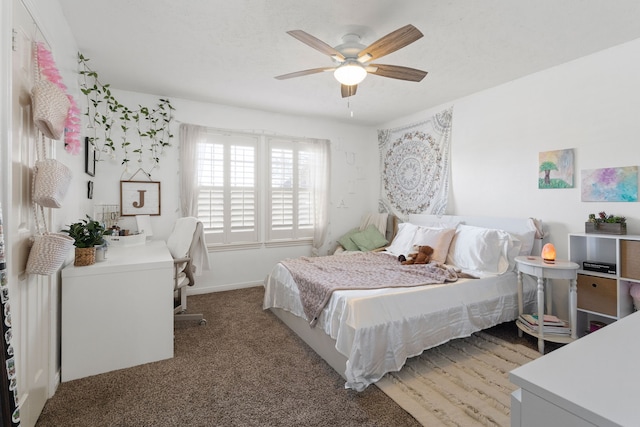 carpeted bedroom featuring ceiling fan