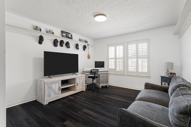 living room with dark hardwood / wood-style flooring and a textured ceiling