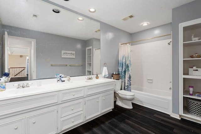 full bathroom with vanity, toilet, wood-type flooring, and shower / bath combo with shower curtain