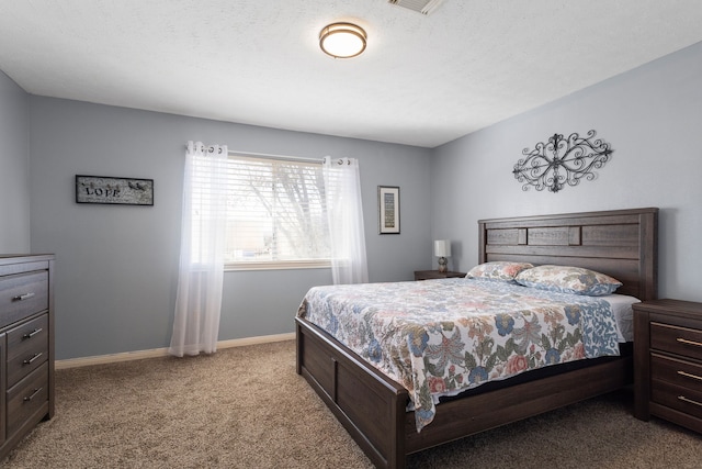 carpeted bedroom with a textured ceiling