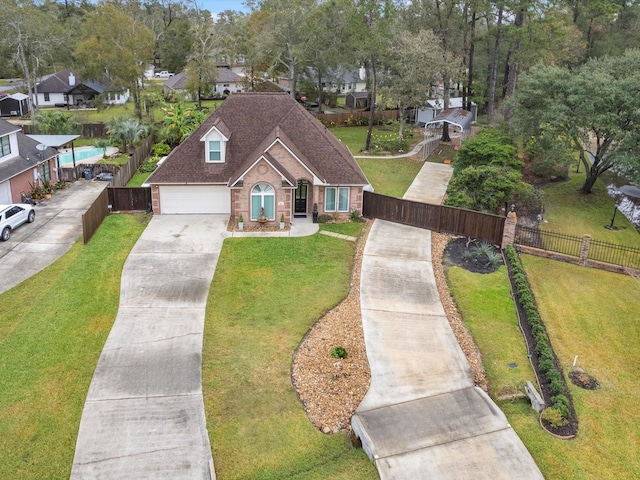 view of front of house with a front yard and a garage