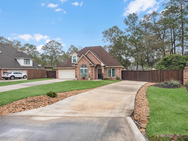 view of front of home featuring a front lawn and a garage