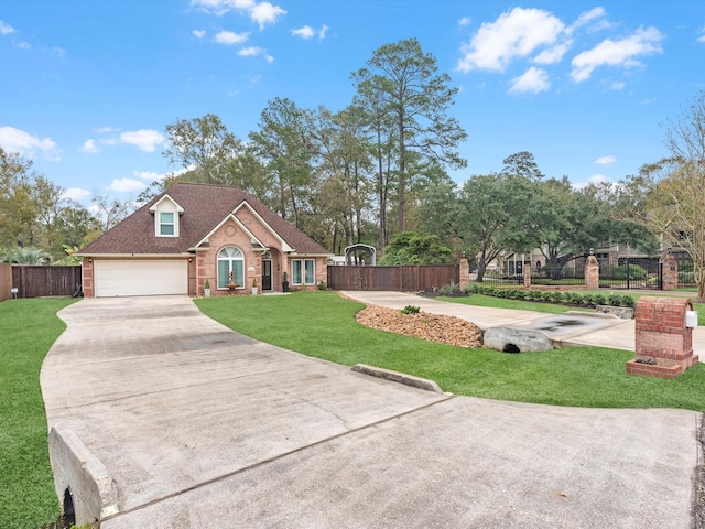 view of front of home featuring a front yard and a garage