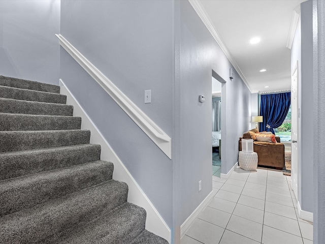 stairs with tile patterned floors and crown molding