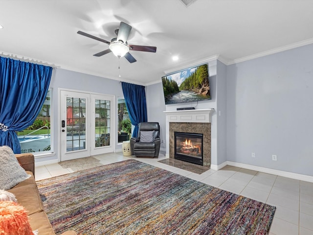 tiled living room with crown molding and ceiling fan