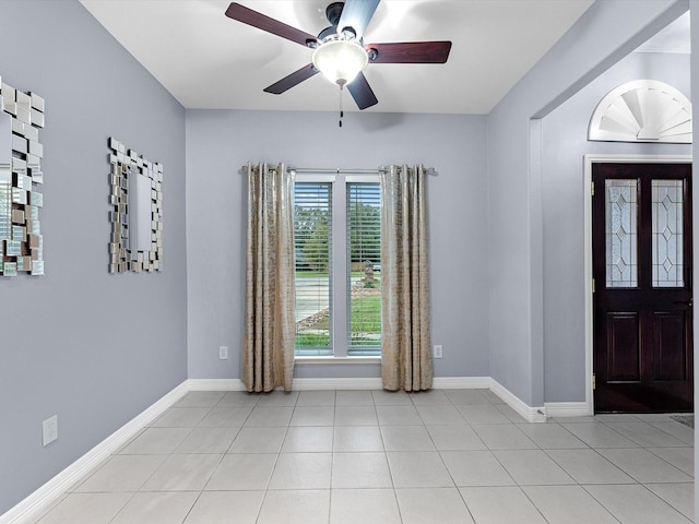 entryway featuring ceiling fan and light tile patterned floors