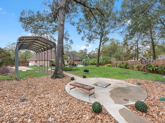 view of yard featuring a patio and a carport