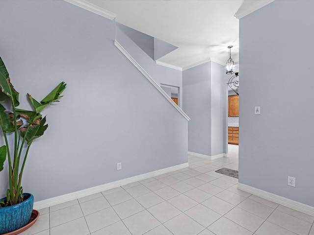 interior space with crown molding and an inviting chandelier