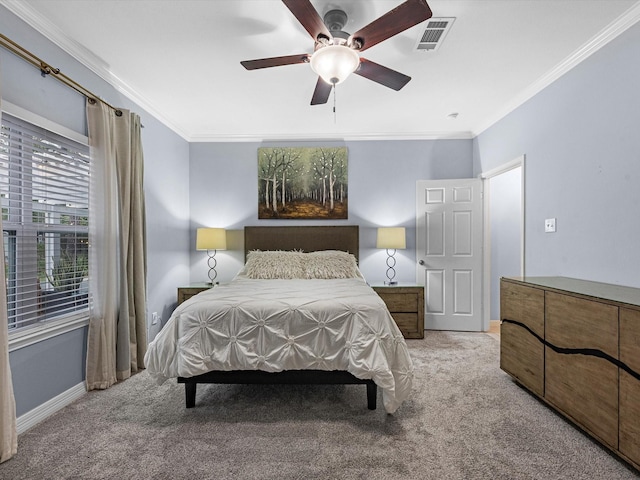 carpeted bedroom with ceiling fan and ornamental molding