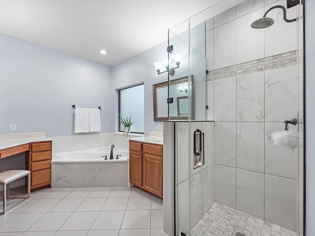 bathroom with tile patterned floors, vanity, and independent shower and bath