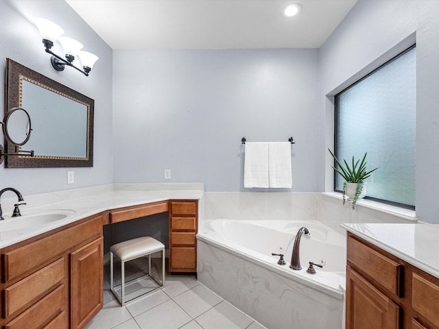 bathroom featuring vanity, tile patterned floors, and a bathing tub