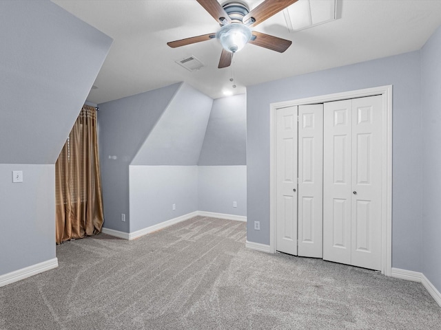 additional living space featuring light carpet, ceiling fan, and lofted ceiling