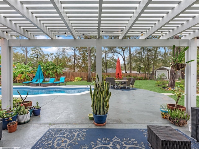 view of patio / terrace with a pergola and a fenced in pool