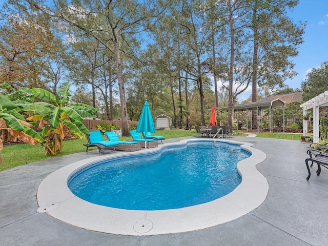 view of swimming pool with a lawn and a patio area