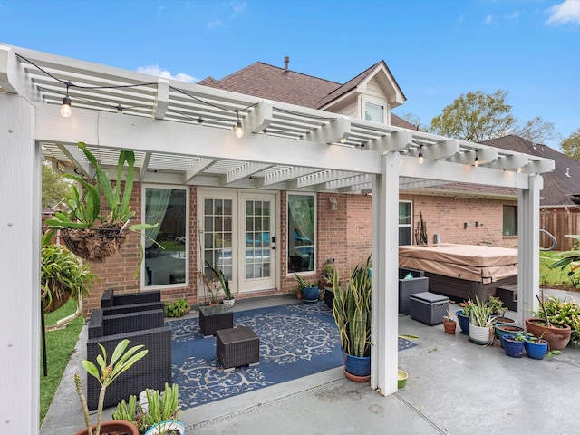 back of property with outdoor lounge area, a patio area, a pergola, and a hot tub