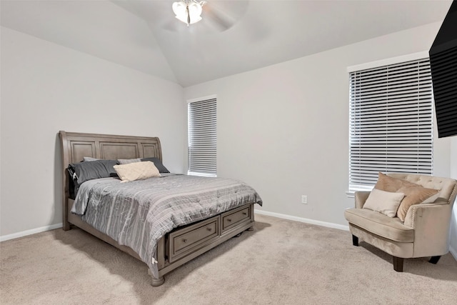 carpeted bedroom with ceiling fan and lofted ceiling