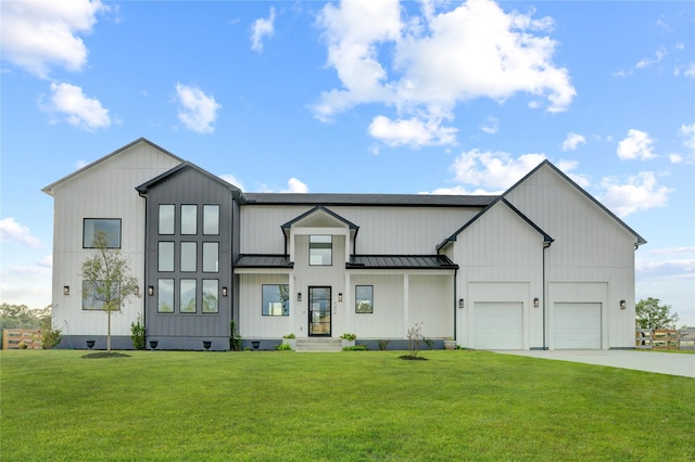 modern farmhouse featuring a front yard