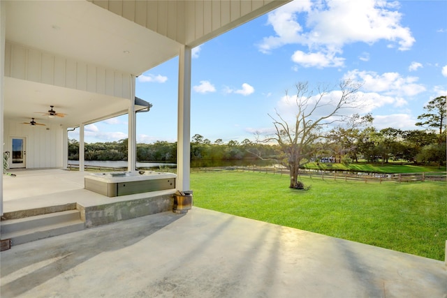 view of patio featuring ceiling fan and a rural view