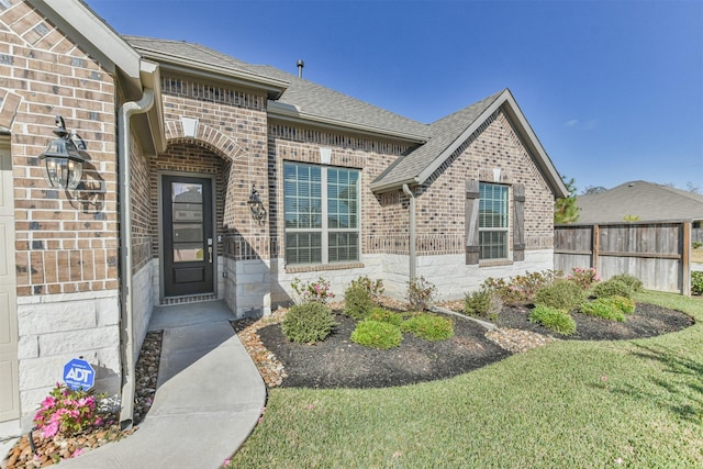 property entrance featuring a yard