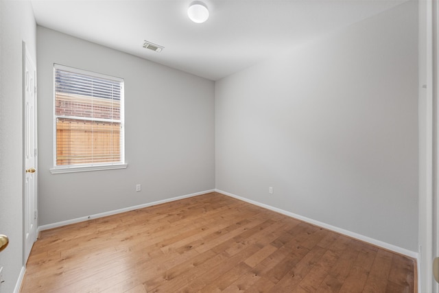 unfurnished room featuring light wood-type flooring