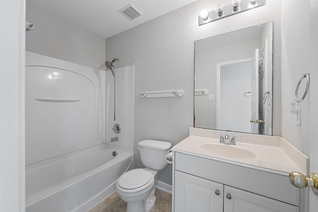 full bathroom featuring washtub / shower combination, tile patterned floors, vanity, and toilet