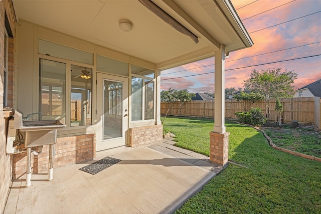 patio terrace at dusk with a yard