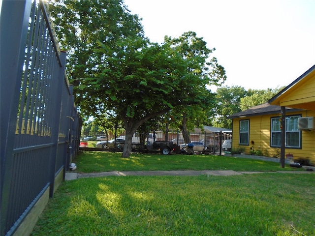 view of yard with a wall mounted AC