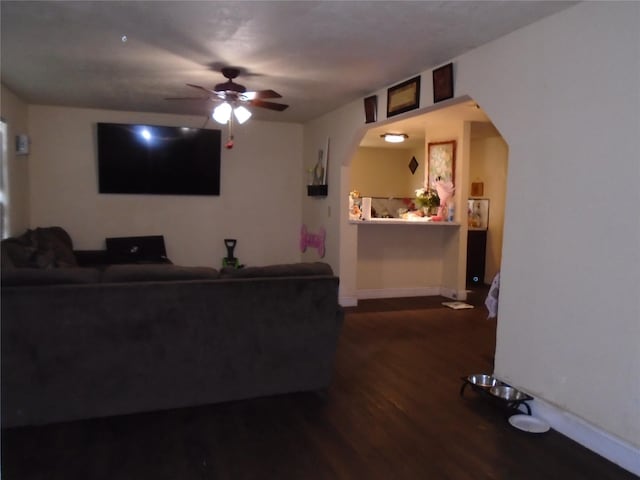 living room with hardwood / wood-style floors and ceiling fan