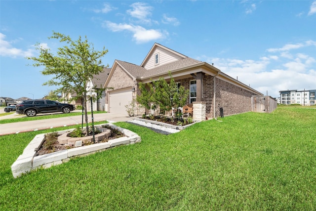 view of front of house with a front yard and a garage