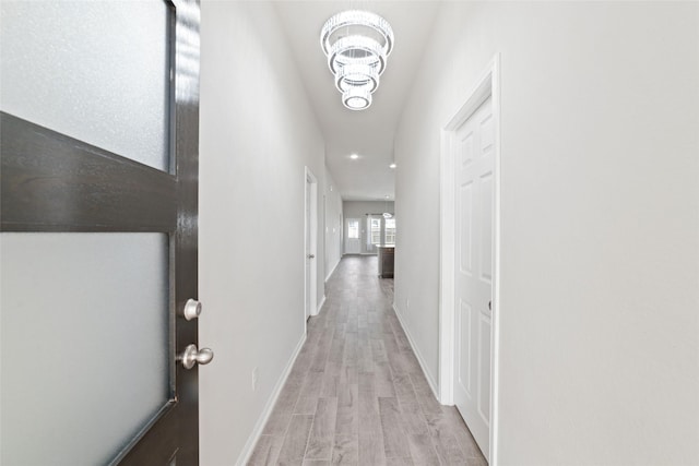 hallway with light wood-type flooring