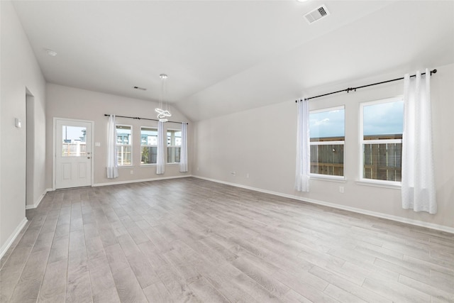 unfurnished living room with light hardwood / wood-style flooring and lofted ceiling