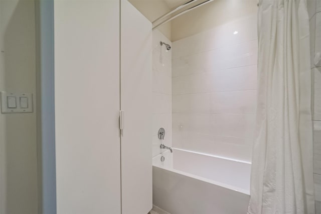 bathroom featuring shower / bathtub combination with curtain