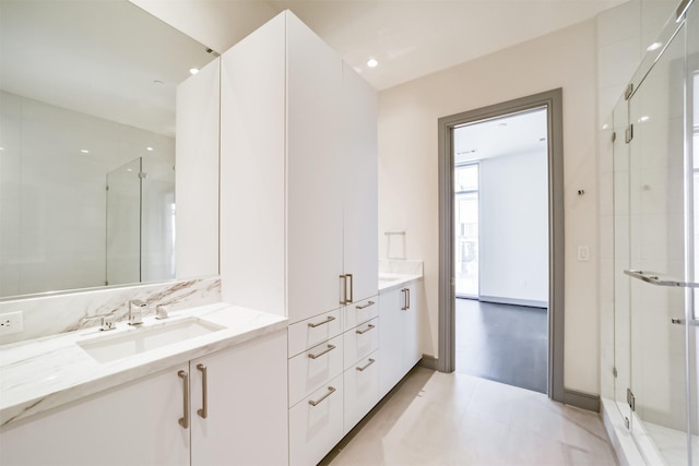 bathroom with vanity and walk in shower