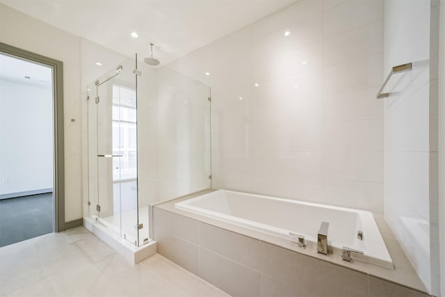 bathroom with plus walk in shower and tile patterned floors