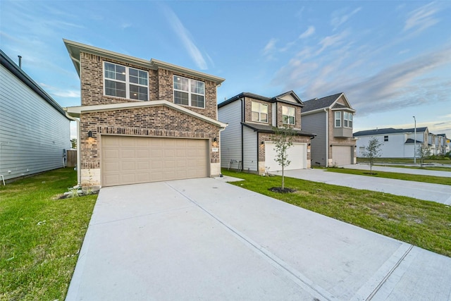 view of front of home featuring a garage and a front yard