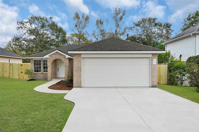 ranch-style home featuring a front yard and a garage