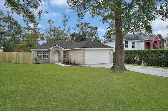 single story home with a front yard and a garage