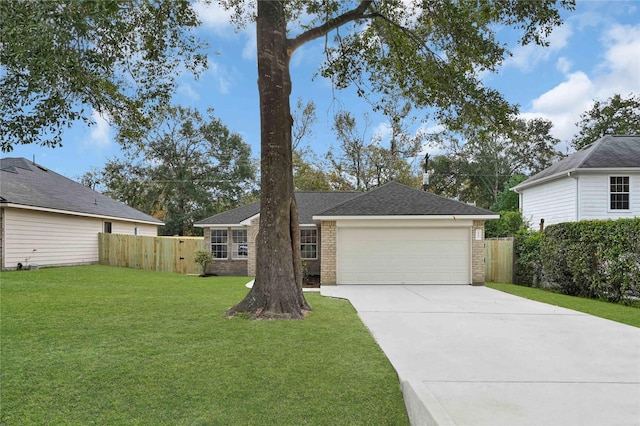 ranch-style house with a garage and a front yard