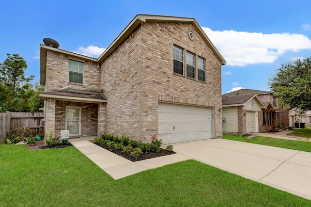 view of front of property featuring a garage and a front lawn