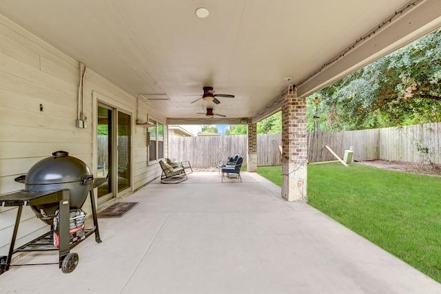 view of patio featuring ceiling fan and a grill