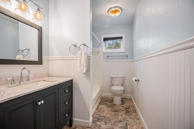 full bathroom featuring vanity, toilet, and bathing tub / shower combination