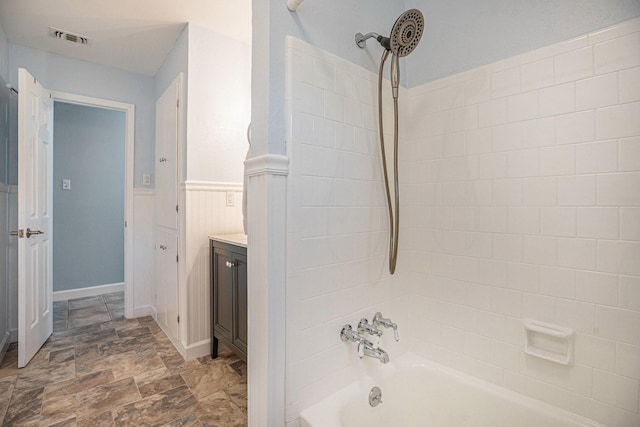 bathroom featuring vanity and tub / shower combination