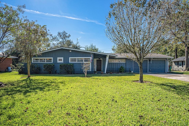 ranch-style home featuring a front yard and a garage