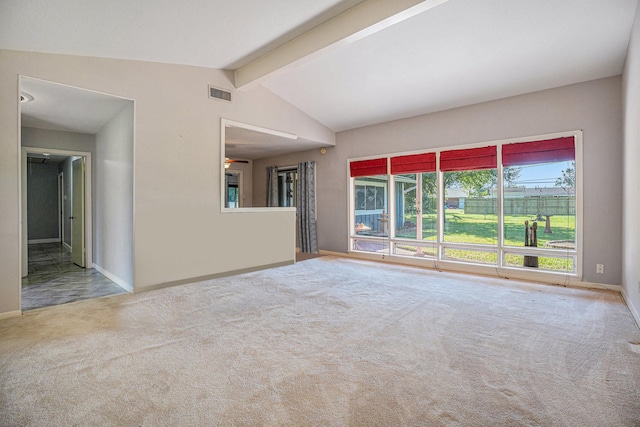 carpeted empty room featuring lofted ceiling with beams and ceiling fan