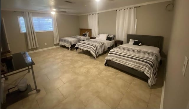 bedroom with ceiling fan and ornamental molding