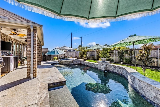 view of pool featuring ceiling fan and an in ground hot tub