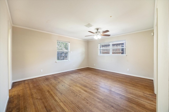 empty room featuring hardwood / wood-style floors, ceiling fan, and crown molding